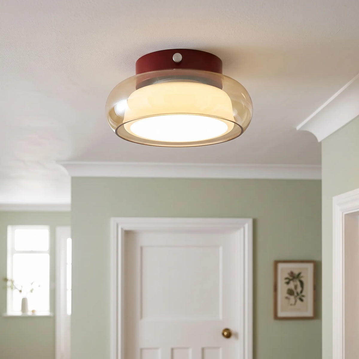 Glass dome flush ceiling light – Amber – in a hallway