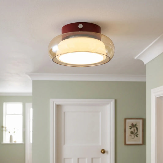 Glass dome flush ceiling light – Amber – in a hallway