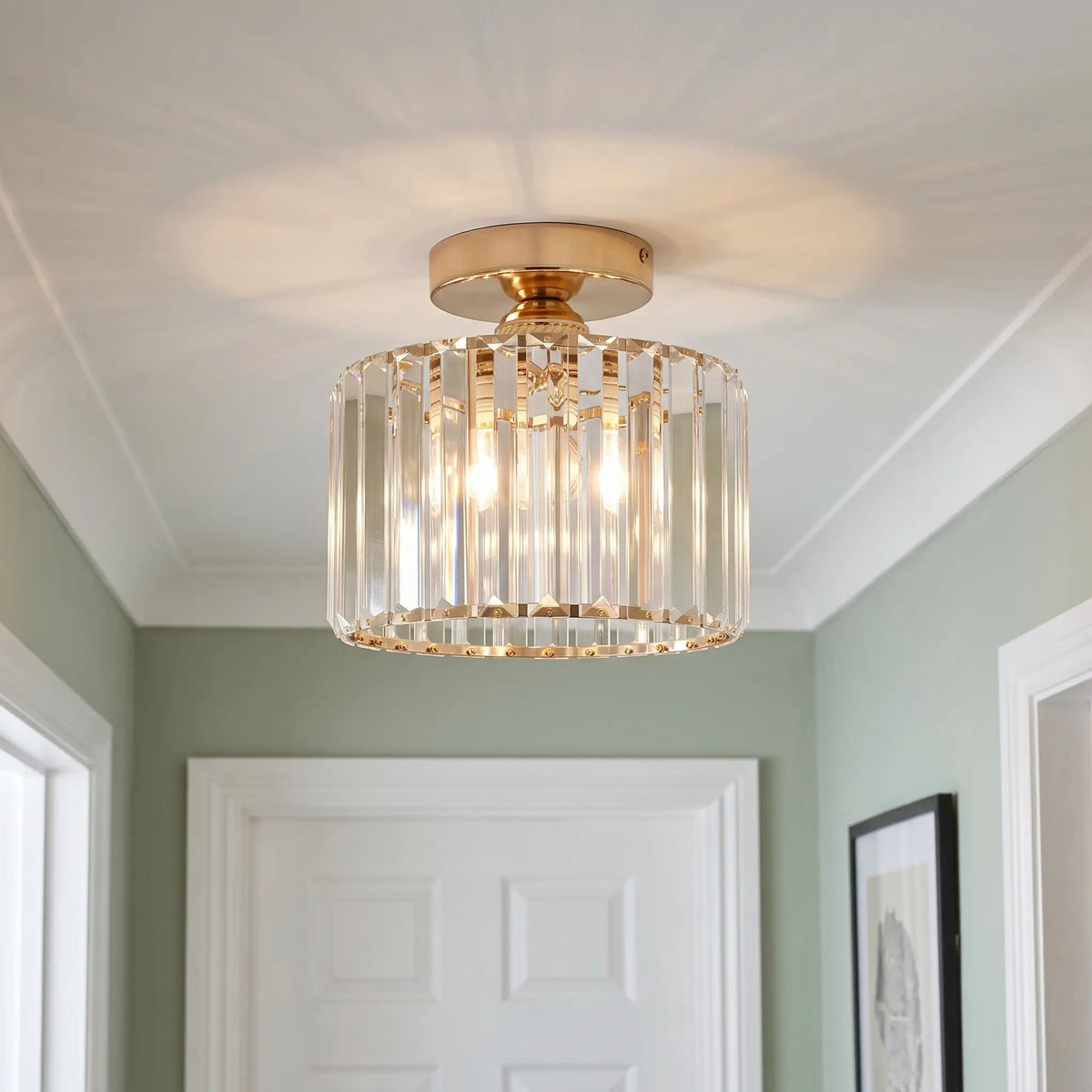 Crystal drum flush ceiling light – Gold – in a hallway
