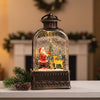 Snow Globe Lantern | Large Light Up Christmas Snow Globe with Swirling Glitter for Mantelpiece & Table | Battery, 27.5cm, Santa, Village or Snowman