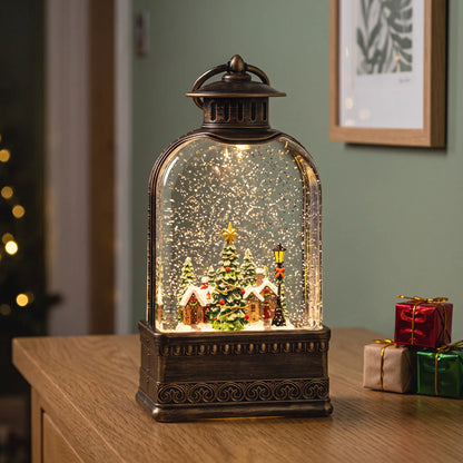 Light-up snow globe lantern with Christmas village scene