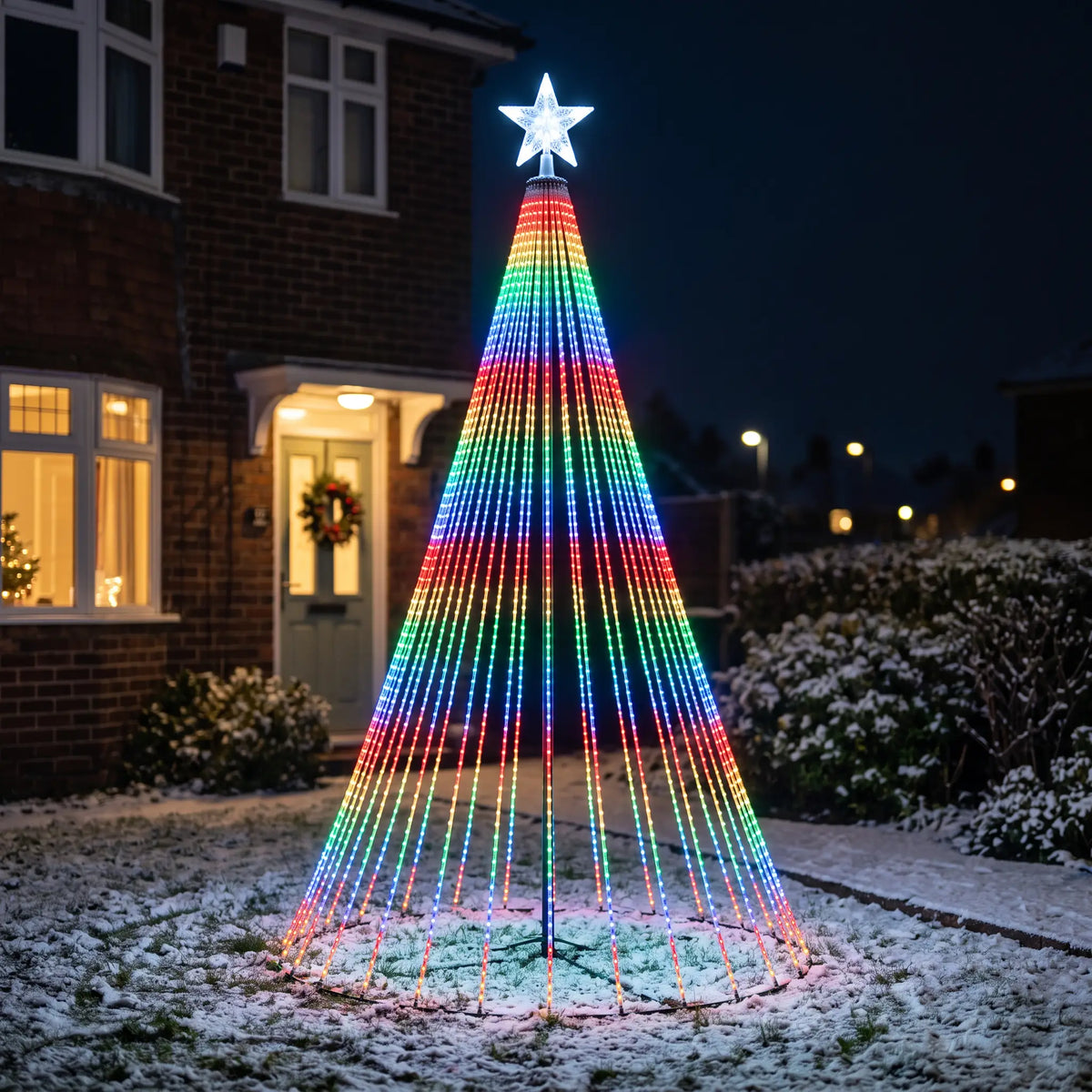 Smart colour changing LED light show Christmas tree lights in a front garden