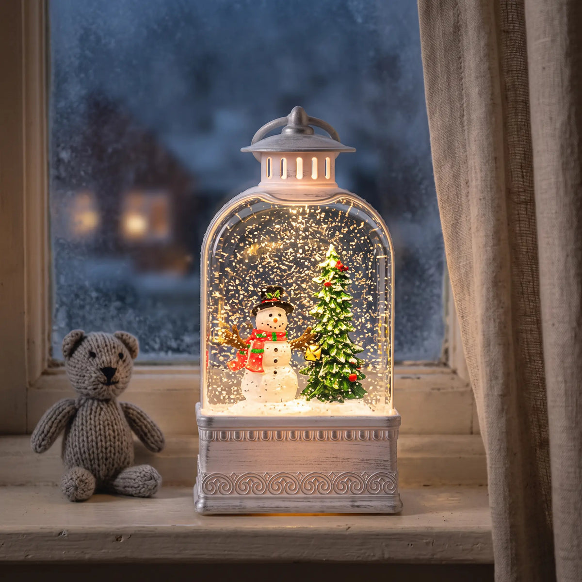 Light-up snow globe lantern with snowman scene