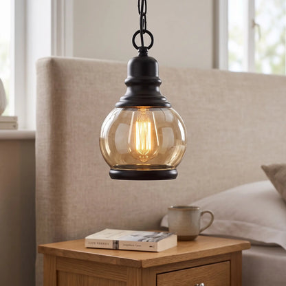 Amber glass industrial pendant light – Round shade – beside a bed