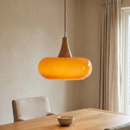 Nordic glass and wood pendant light – Amber – over a dining table