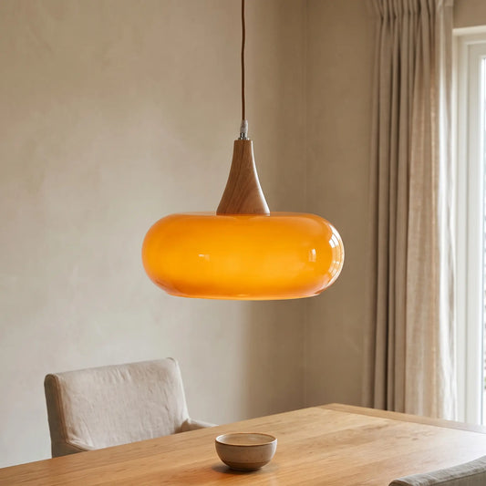 Nordic glass and wood pendant light – Amber – over a dining table