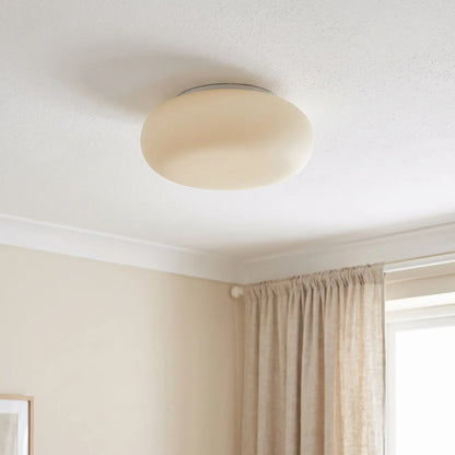 Cloud pebble flush ceiling light – switched off in a bedroom