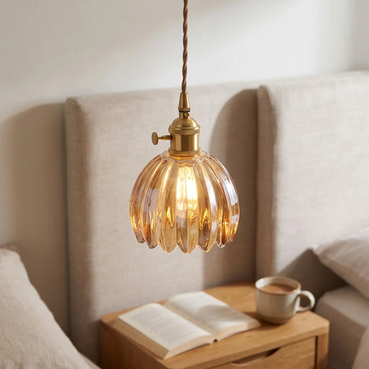 Small flower glass pendant light – Amber – beside a bed
