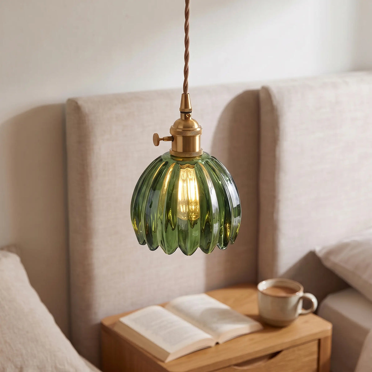 Small flower glass pendant light – Green – beside a bed