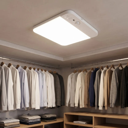 Square battery motion sensor light on a walk-in wardrobe ceiling