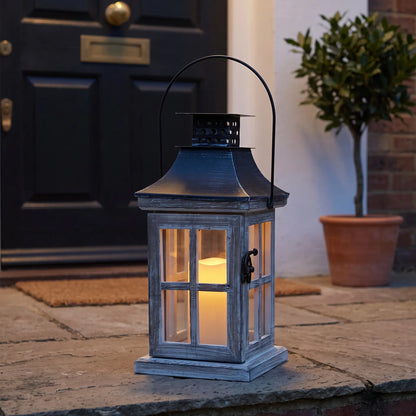 Grey wash wooden candle lantern on a front doorstep at dusk, 26cm