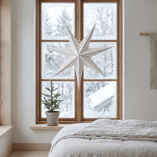 Large 60cm white paper star lantern hanging in a bedroom window