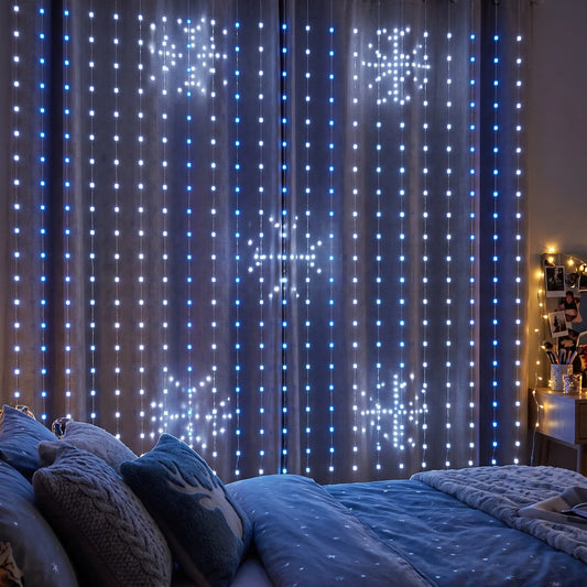 LED curtain lights showing snowflakes on a bedroom wall