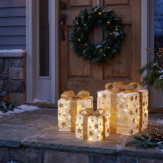 Light up Christmas gift boxes on a porch step by the front door