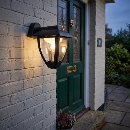 Black coach lantern outdoor wall light on a porch