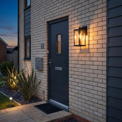 Modern black box lantern outdoor wall light beside a front door
