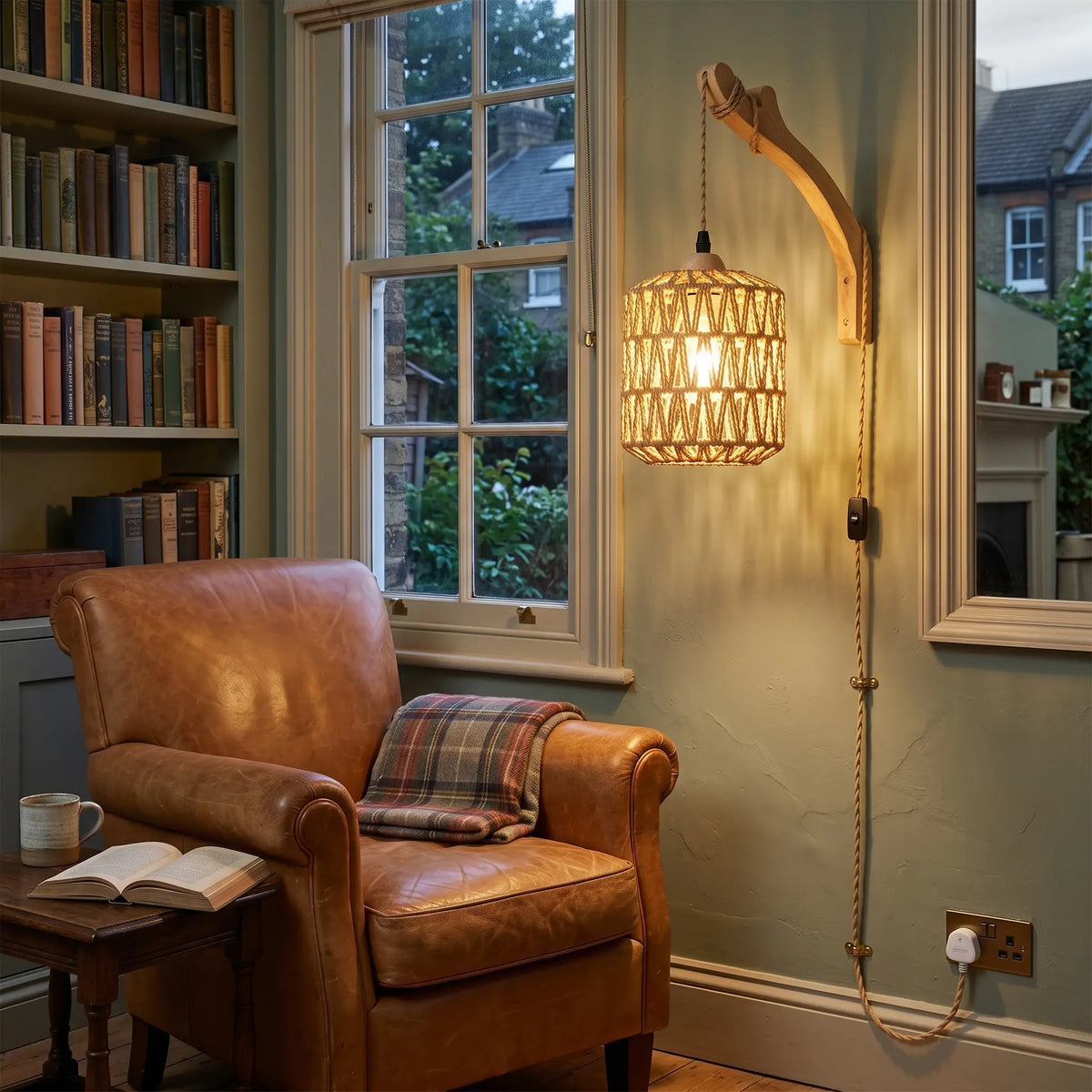 Plug in woven bamboo drum wall light in a reading corner
