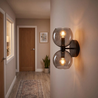 Smoke grey glass hourglass wall light in a hallway
