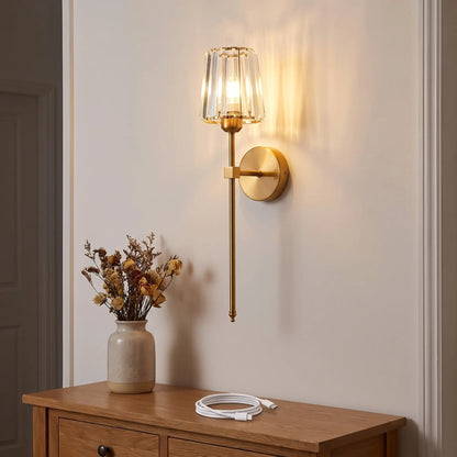 Gold crystal rechargeable wall sconce on a clean hallway wall with no wiring, USB-C charging cable on the table