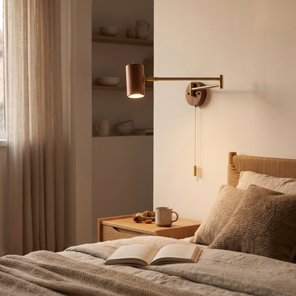 Walnut swing arm wall light with brass arm, reading light above a bed