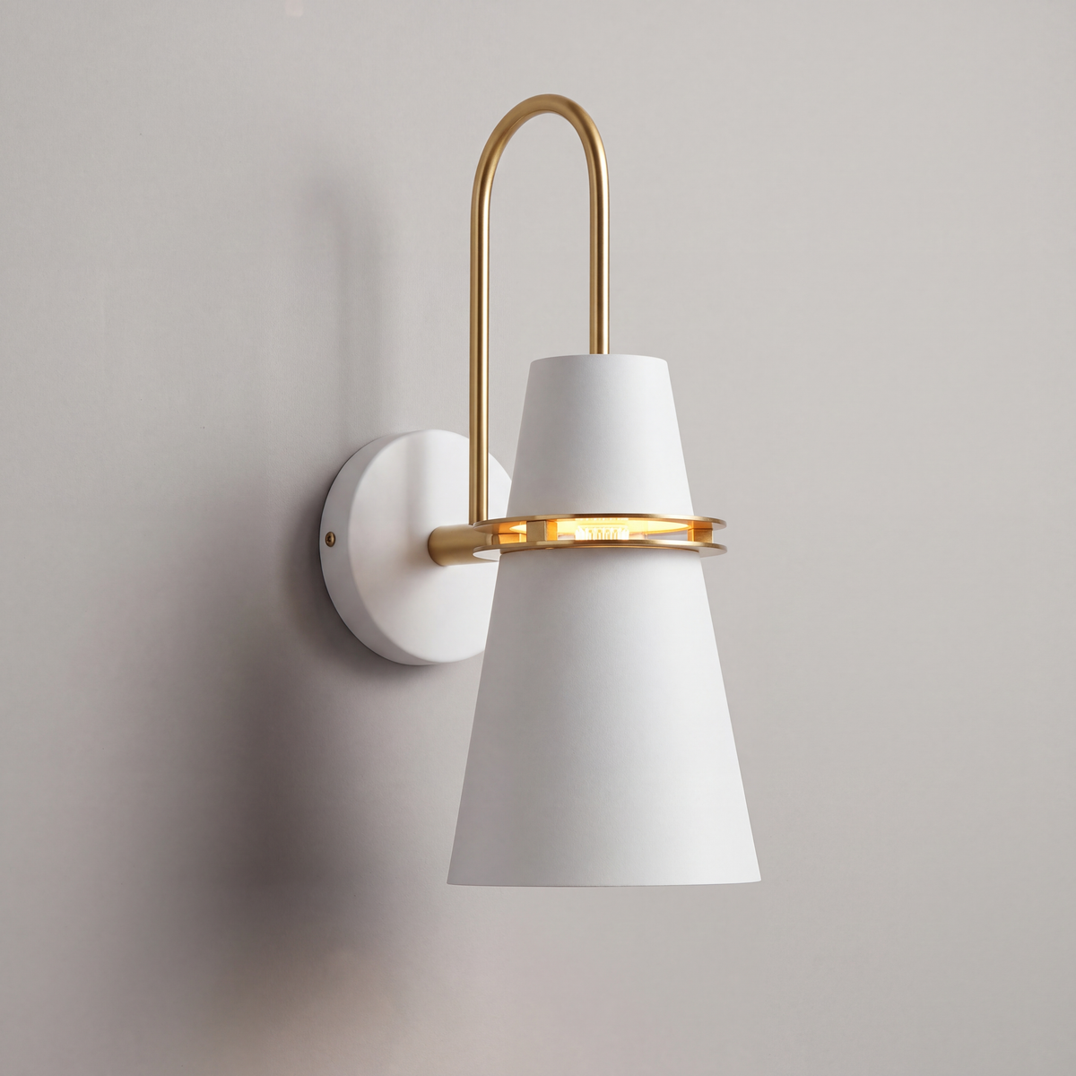 White Nordic cone wall light with brass ring, studio product photo