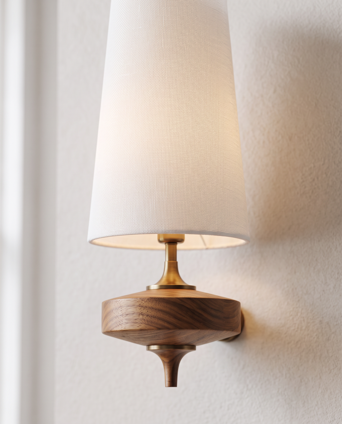 Close-up of white fabric shade and turned wooden base