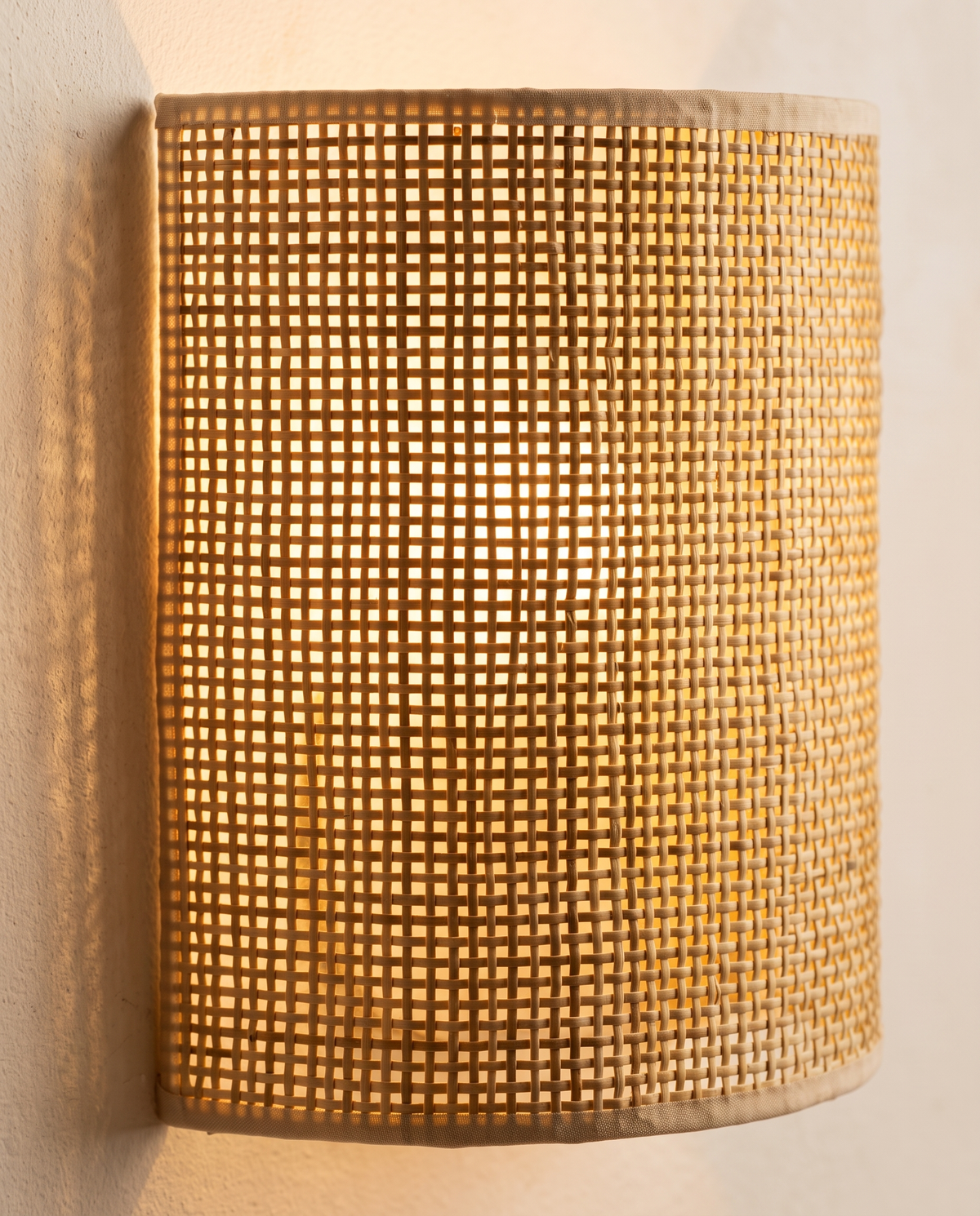 Close-up of woven grid shade glowing