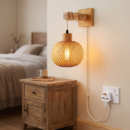 Plug-in bamboo wall light with cable running to a UK 3-pin plug socket