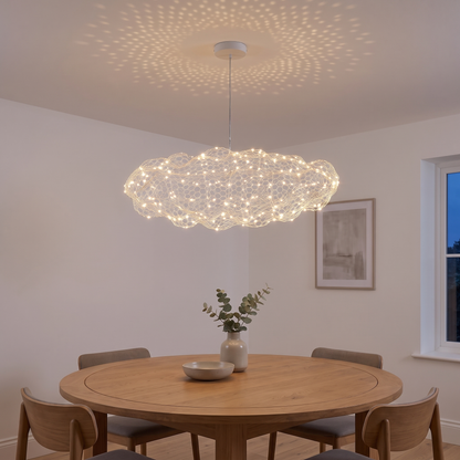 Cloud wire mesh LED pendant light over a dining table