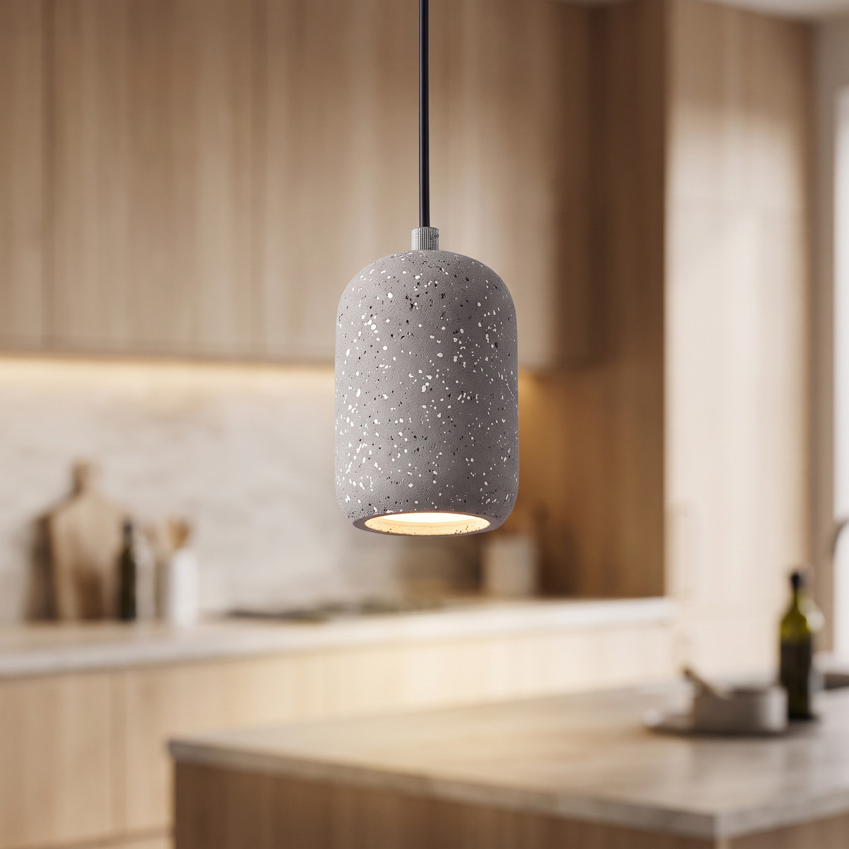 Grey speckled concrete mini pendant light, close-up in a kitchen
