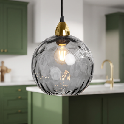 Smoke grey rippled glass globe pendant light, close-up in a kitchen