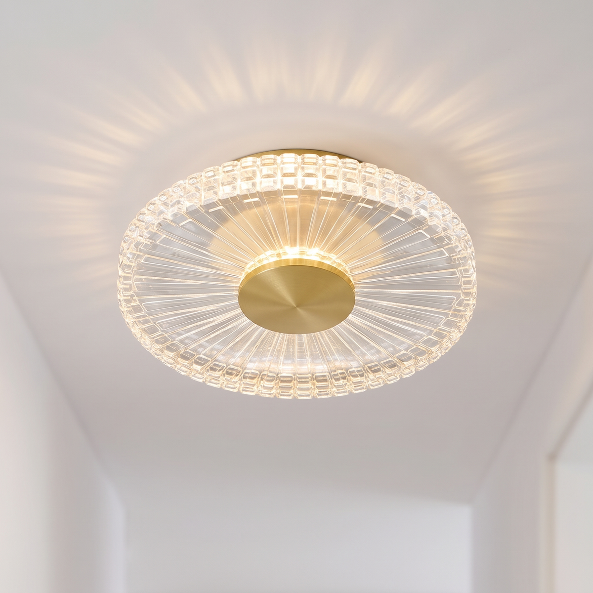 Small gold crystal-effect flush LED ceiling light, close-up on a hallway ceiling