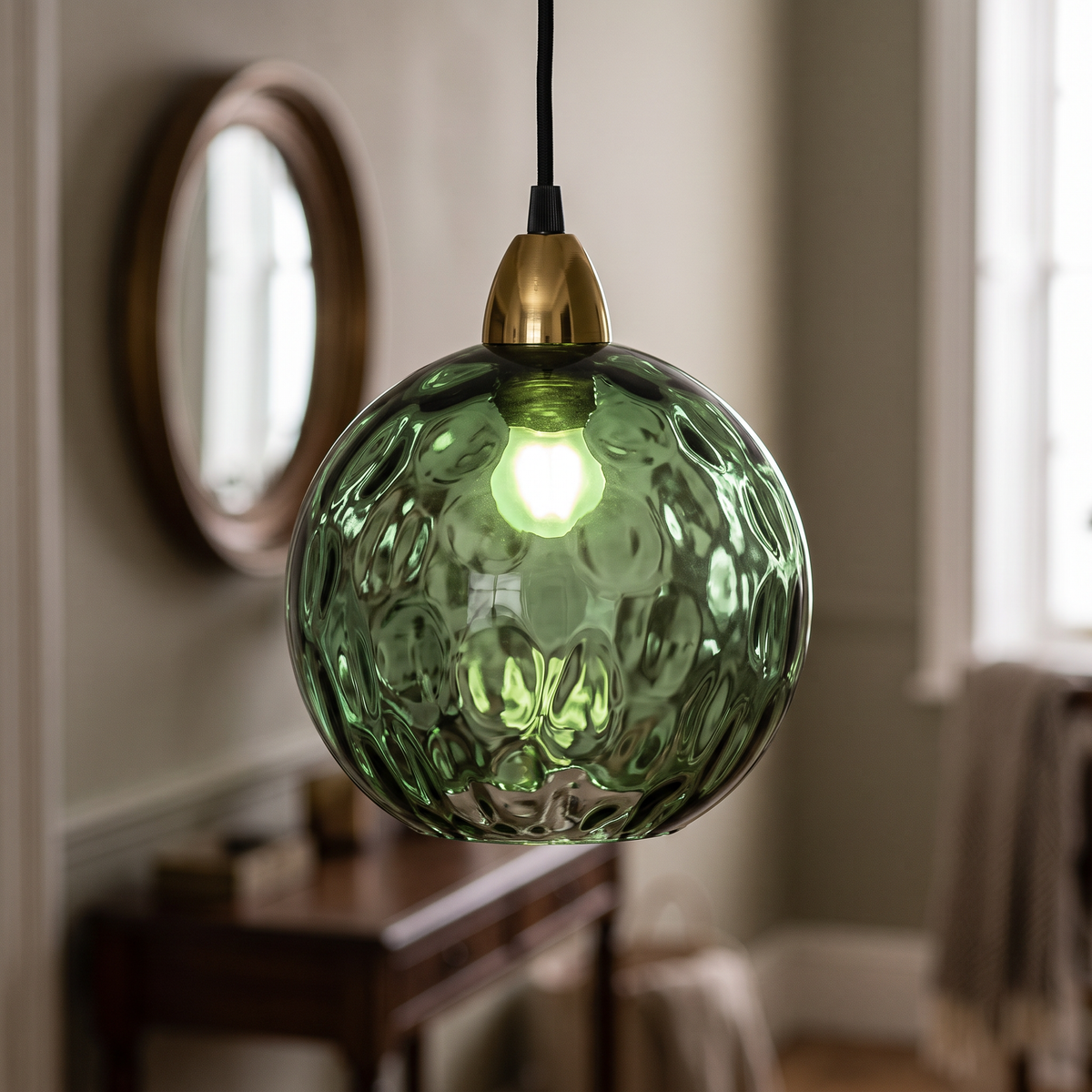 Dark green rippled glass globe pendant light, close-up in a hallway
