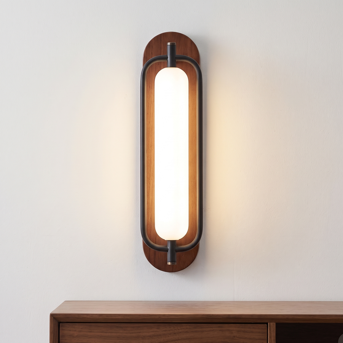 Walnut wood and black capsule LED wall light, close-up above a sideboard