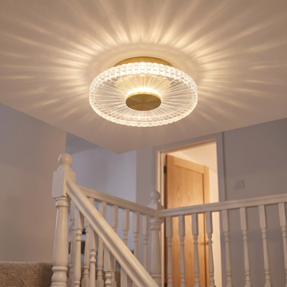Small gold crystal-effect flush ceiling light lit on an upstairs landing ceiling