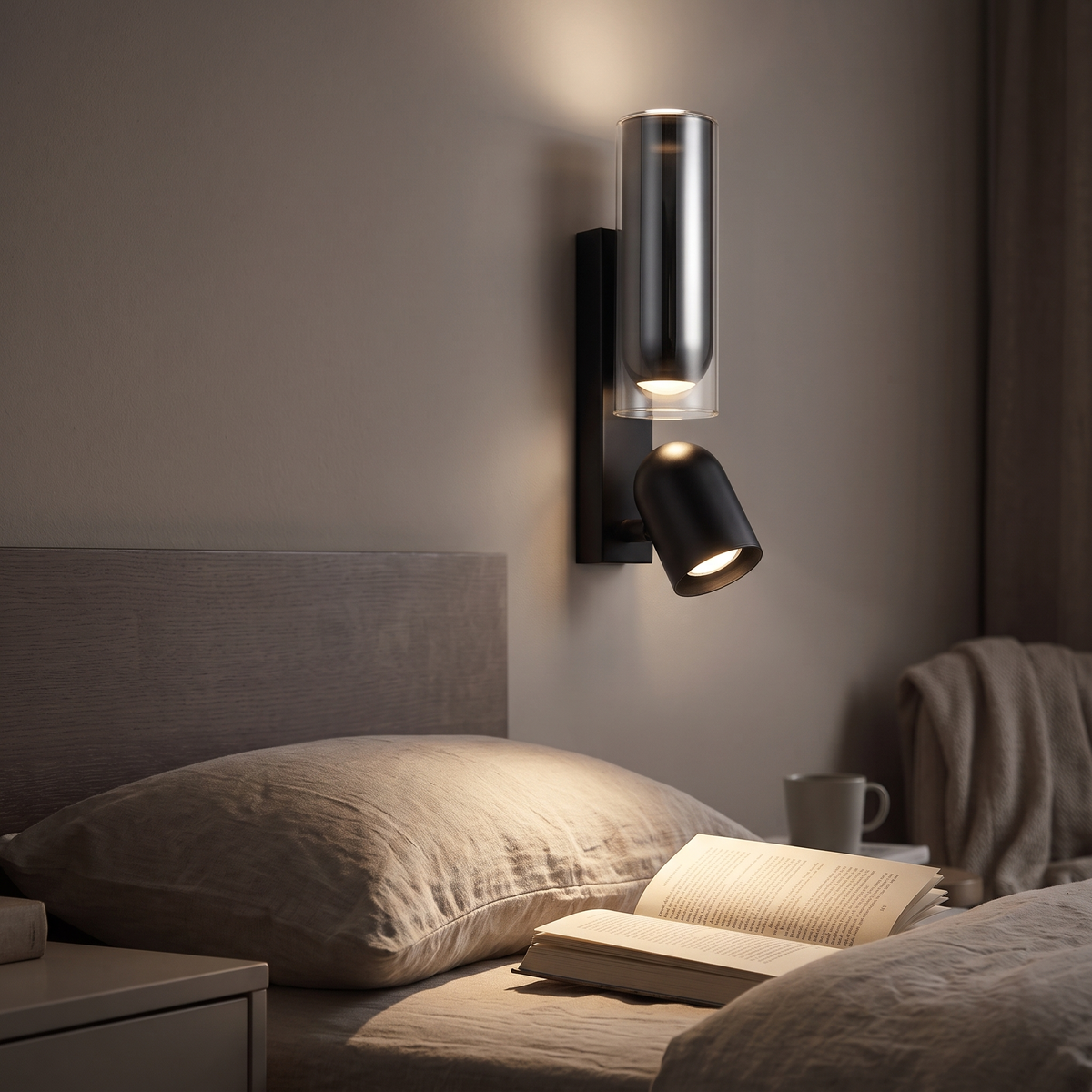 Black spotlight wall light above a headboard, angled to light a book on the bed at night