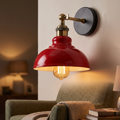 Vintage industrial dome wall light in red above a reading chair