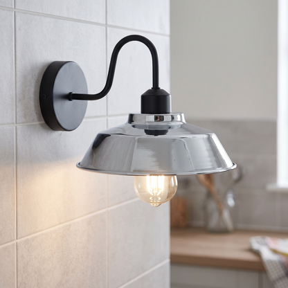 Gooseneck barn wall light with chrome shade on a kitchen wall