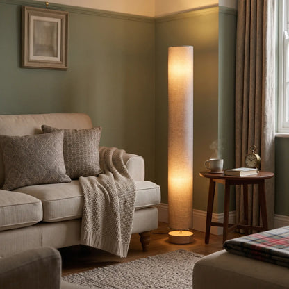 Grey linen column floor lamp with wooden base in a living room