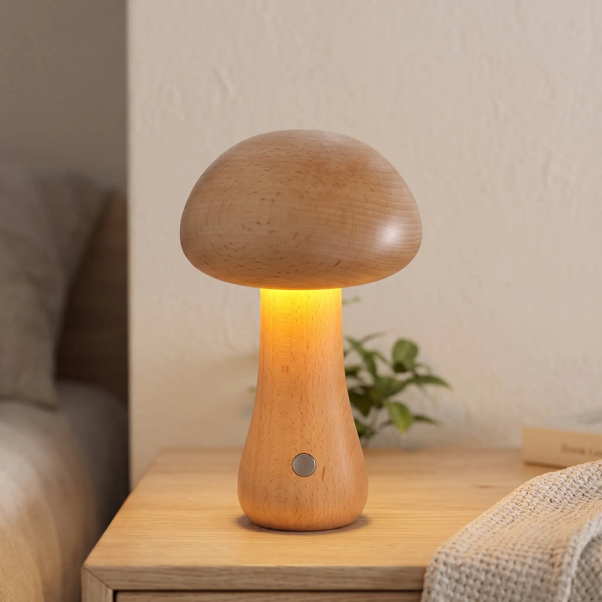Tall beech wooden mushroom lamp on a bedside shelf