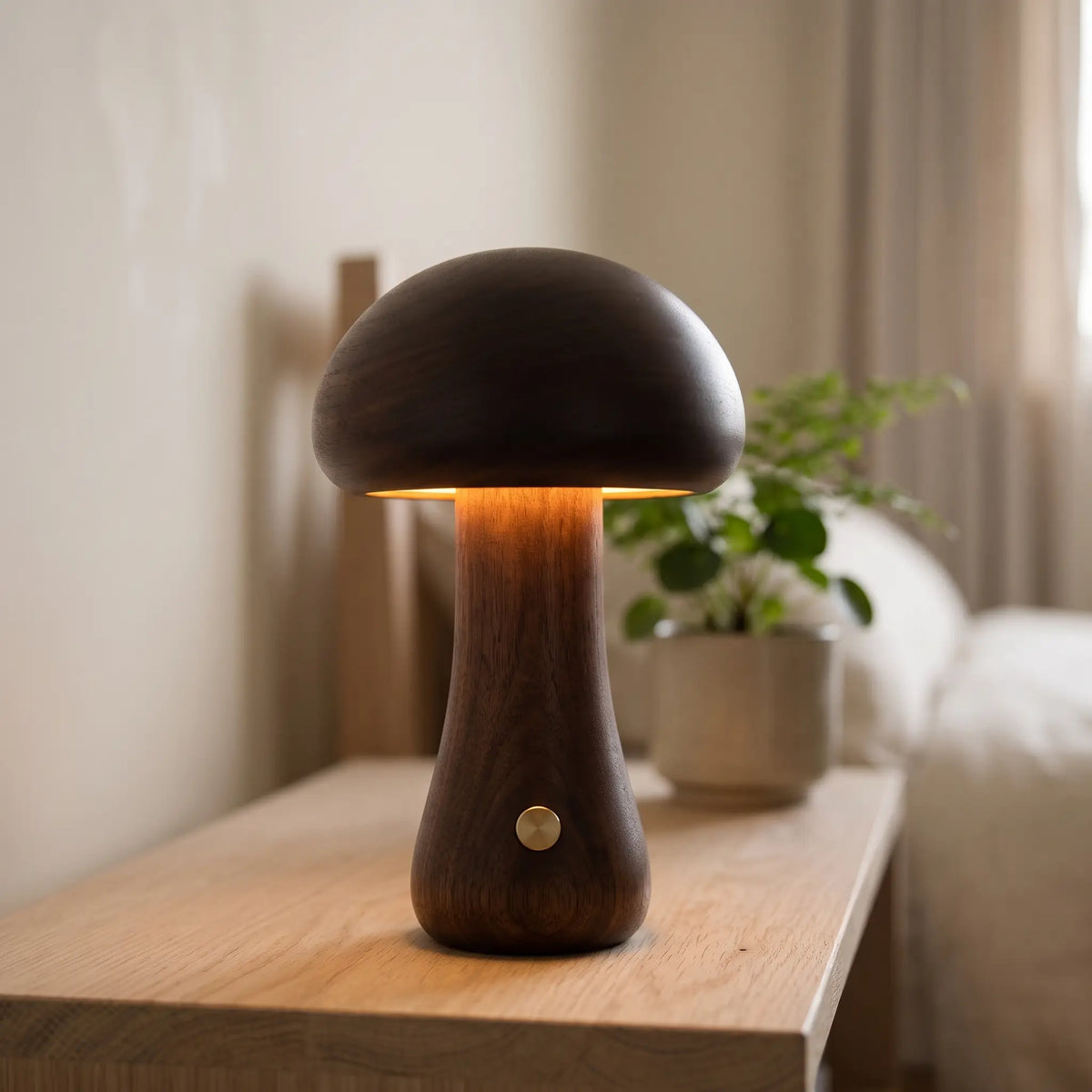 Tall walnut wooden mushroom lamp on a bedside shelf