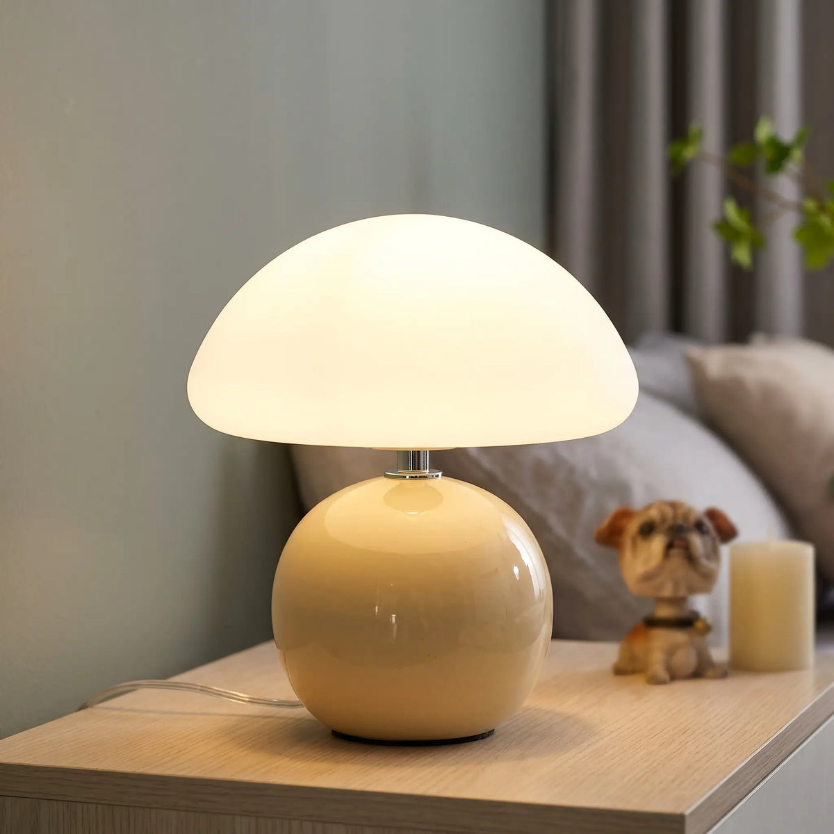 Beige ceramic mushroom table lamp on a nightstand