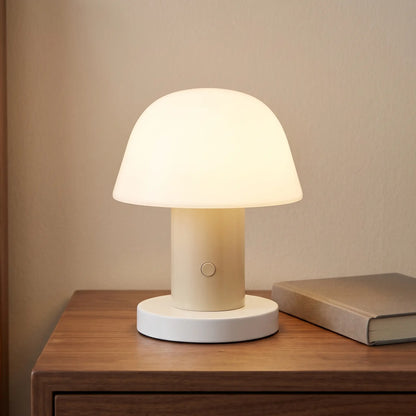 Sand cordless mushroom lamp on a bedside table