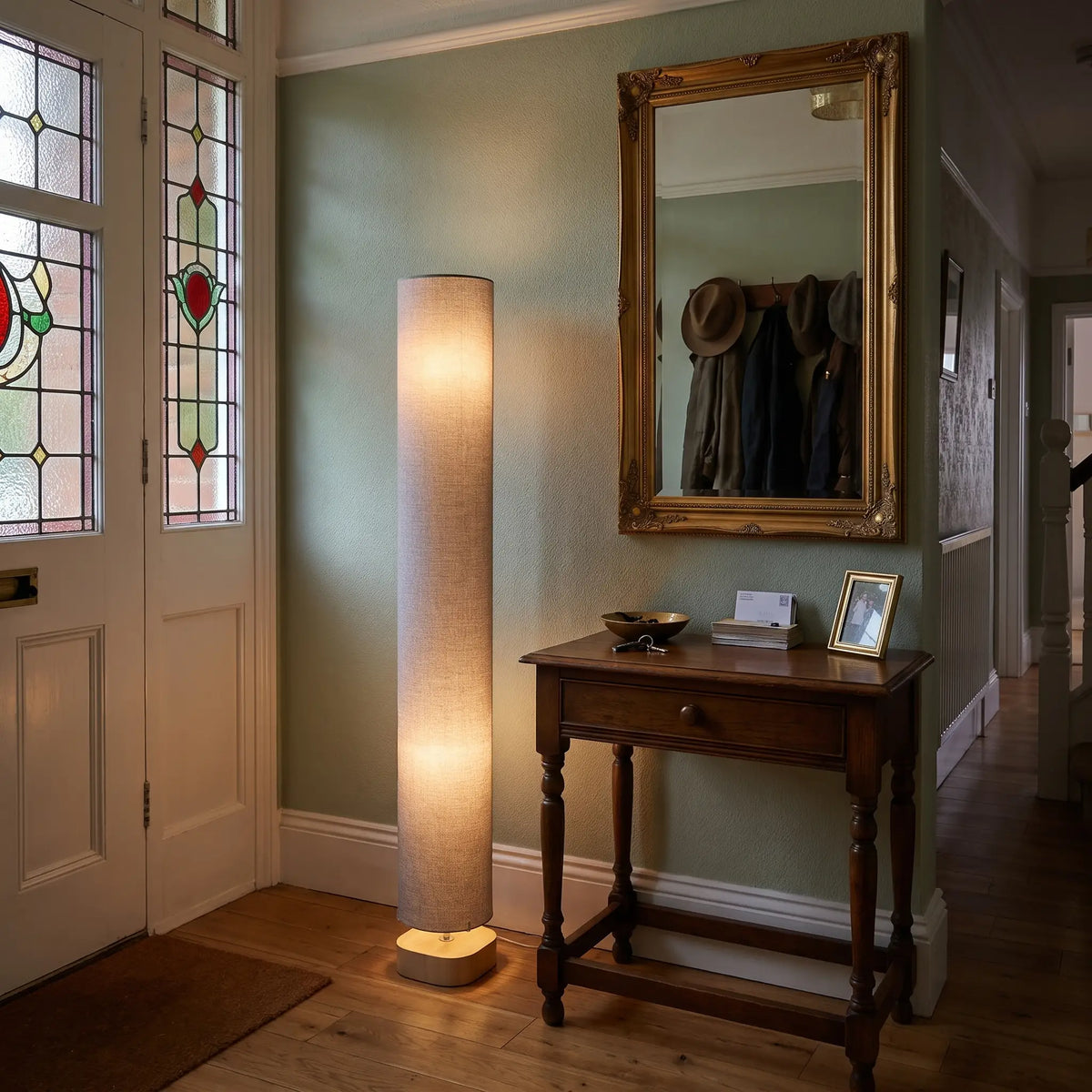 Grey linen column floor lamp in a hallway