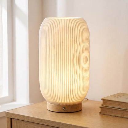 Ripple textured table lamp with wooden base on an oak sideboard