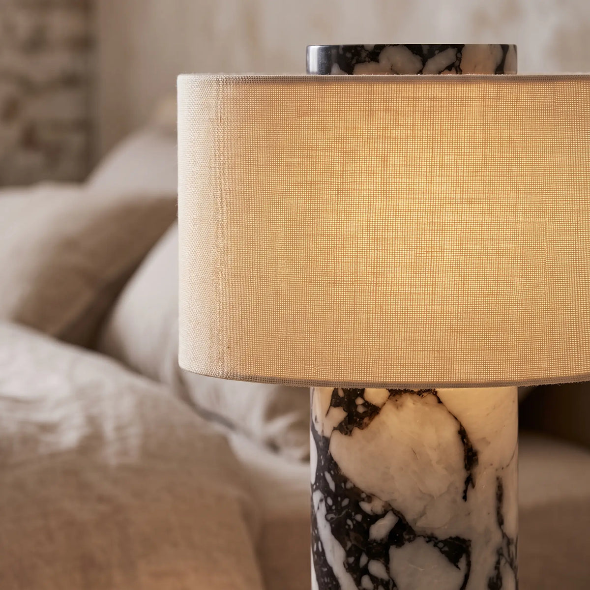 Close-up of the marble veining and linen shade