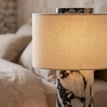 Close-up of the marble veining and linen shade