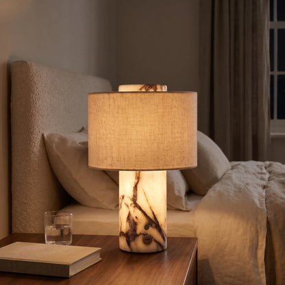 Cordless marble table lamp with glowing marble base and linen shade
