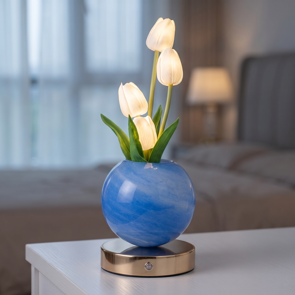 Glass tulip lamp with white tulips in a blue pot