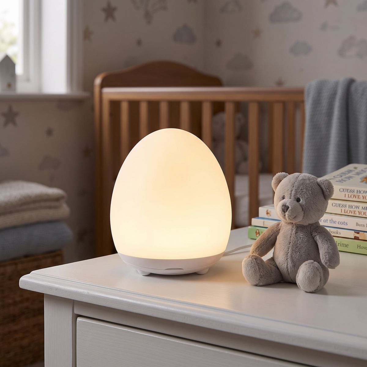 Egg night light glowing warm white in a nursery